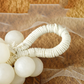 Sapone artigianale a forma di grappolo d'uva con perle