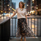Completo due pezzi da donna composto da maglione e gonna fluida con stampa leopardata