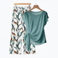 Completo donna con top a nodo laterale e pantaloni fantasia