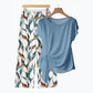 Completo donna con top a nodo laterale e pantaloni fantasia