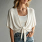 Cardigan in maglia tinta unita a maniche 3/4 con motivo traforato